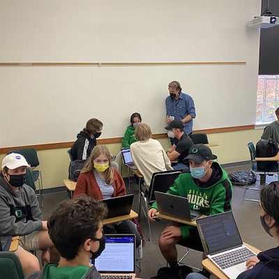 Professor Casey Shoop works with breakout groups in his class. Professor Casey Shoop works with breakout groups in his class.