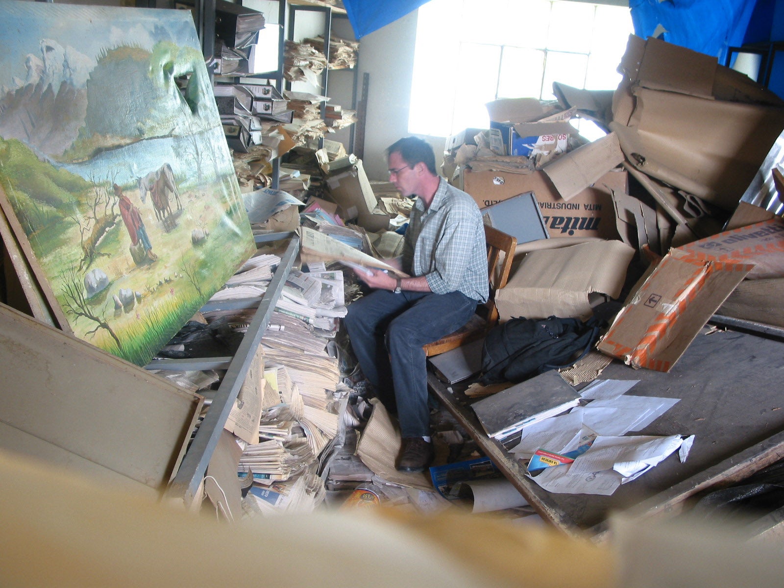 Mark Carey working in an archive in Peru