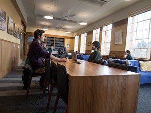 Students collaborating in the Chapman library Students collaborating in the Chapman library