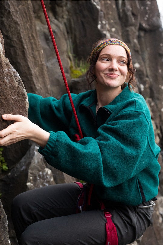 Ava Hearn climbing basalt columns.