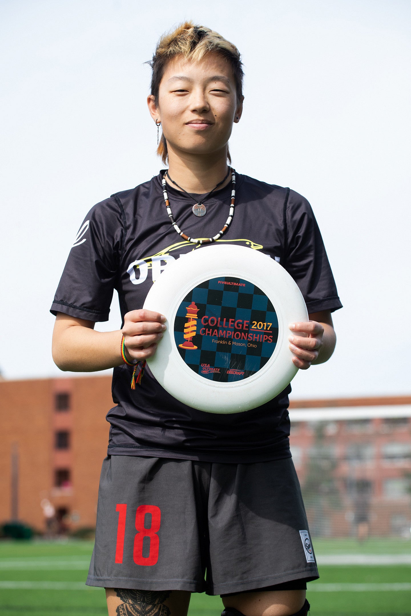 Eliana Norton holds a white frizbee. 