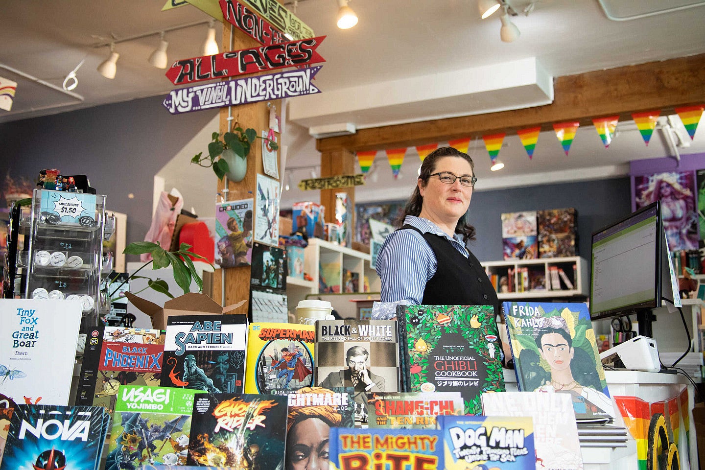 Katie Pryde inside her bookstore, Books With Pictures
