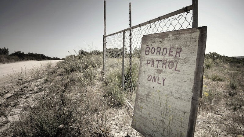 US/Mexico border with border patrol sign