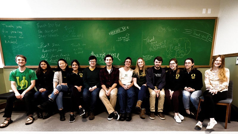 Students in front of 'thank you' sign Students in front of 'thank you' sign