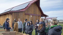 Students standing in front of a barn at Bethel Farm
