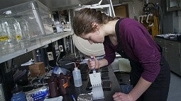 student working in a science lab student working in a science lab