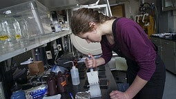 student working in a science lab