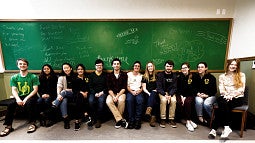 Students in front of 'thank you' sign Students in front of 'thank you' sign