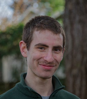 Head shot of Tamir Eisenbach-Burner