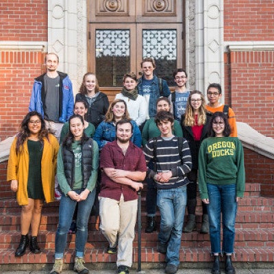 group of undergraduates standing on brick steps