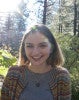 Mugshot of Julia Rehmann standing in a wooded area