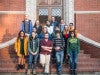 group of undergraduates standing on brick steps